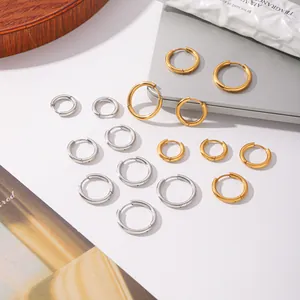 Detail showing various sizes of titanium steel hoop earrings in gold and silver finish