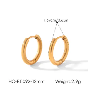 Close-up of gold titanium steel hoop earrings with 1.67cm diameter and 2.9g weight