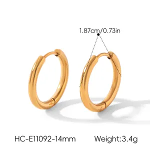 Close-up of minimalist golden titanium steel hoop earrings with size and weight info