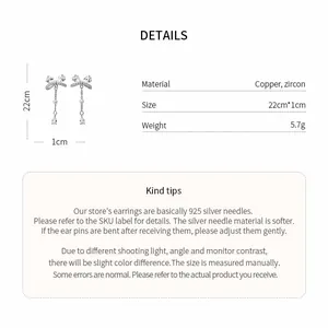 Detailed product specifications for zircon bow dangle earrings with silver needle material