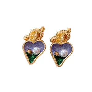 Vintage heart-shaped gold earrings with purple enamel and white pearls