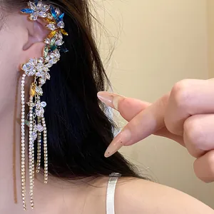 Close-up detail of colorful zircon flower ear cuff with long crystal tassels