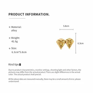 Detailed view of vintage gold-colored face mask portrait earrings with size specifications