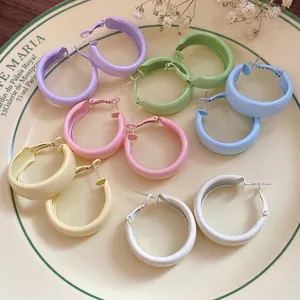 Elegant pastel spray painted round hoop earrings with silver needles for beach vacation style