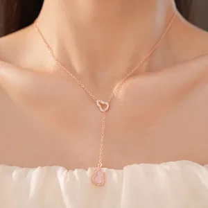 Elegant rose gold y-necklace with pink zircon hollow gourd pendants shown on female model
