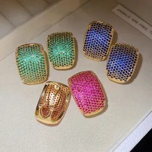 Close-up of vintage C-shaped earrings with colorful micro-pave cubic zirconia stones