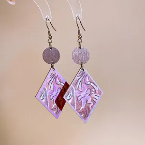 Unique bohemian wooden earrings featuring artistic printed rhombus pendants and bronze ear hooks