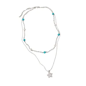 Double-layer necklace featuring turquoise beads, pearls, and a zircon-paved star charm