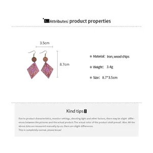 Detail view of bohemian wood chip earrings showing 8.7cm length and material specs.