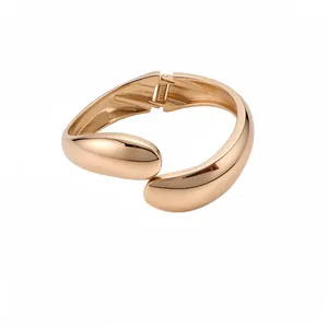 Fashionable minimalist rose gold twisted teardrop bangle bracelet with a secure hinge closure