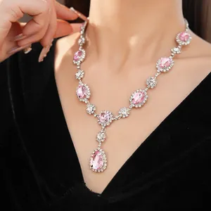 Close-up of luxury pink teardrop gemstone necklace with sparkling crystal accents