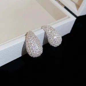 Elegant teardrop earrings with shimmering cubic zirconia pavé setting on white box