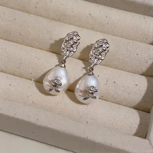 Vintage pearl drop earrings with wrinkled silver finish and rose detail