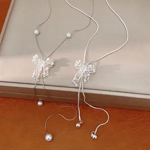 Silver Plated Copper Hollow Bowknot Pendant Necklace For Women With Zirconia Artificial Pearl Adjustable Clavicle Chain Jewelry
