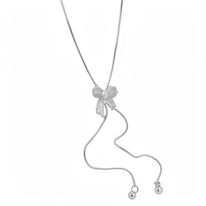 Elegant silver hollow bowknot necklace with adjustable snake chain for women.