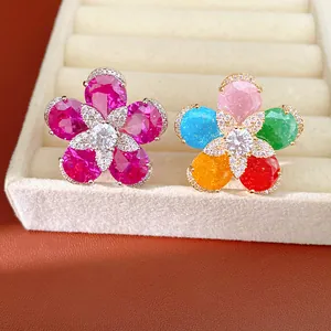 Close-up of 18k gold plated flower rings featuring vibrant multi-color cubic zirconia.