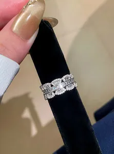 Detailed macro view of a silver lace ring featuring sparkling cubic zirconia