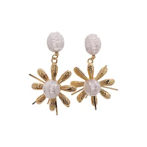 Vintage palace style wrinkled flower earrings with elegant pearls on a white background.