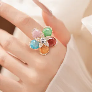 Detailed view of an 18k gold-plated flower ring featuring five colorful stones.