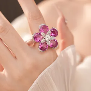 Close-up of 18k gold plated flower ring with vibrant pink and white zircons
