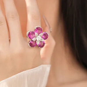 Close-up of pink zircon flower open ring with exquisite gold plated details