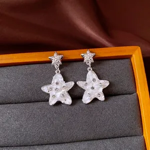 Elegant silver star earrings with inlaid rhinestones and mother-of-pearl finish