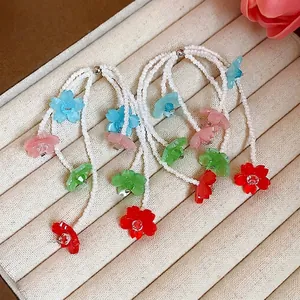 Handmade colorful resin flower tassel earrings with white seed beads for summer vacation