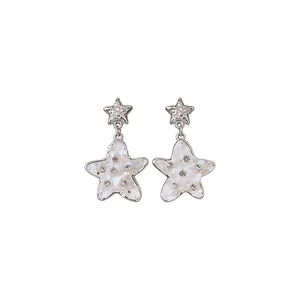 Elegant silver needle star earrings with rhinestones and pearlescent inlay.