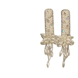 Elegant French style hair clips featuring pearl flowers and rhinestone tassel drops