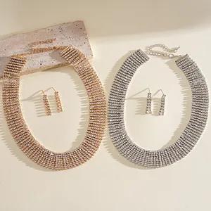 Detailed top-down view of luxury rhinestone tassel necklace and earring jewelry sets