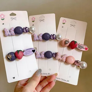 Exquisite hair clips with strawberry, polka dot bow, and pearl details
