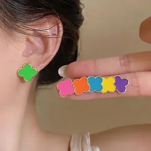 Vibrant dopamine color clover stud earrings in various bright enamel floral shades.