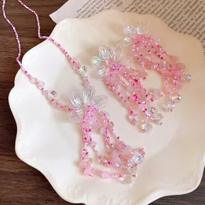Set collana e orecchini con fiori di perline rosa e nappe di cristallo scintillante