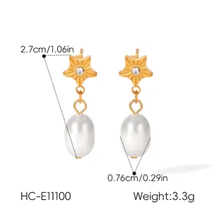 Detail view of gold star earrings with pearl drops showing 2.7cm length and 3.3g weight.