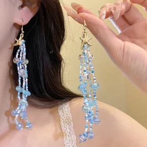 Handmade blue and white beaded starfish tassel earrings for beach vacation jewelry