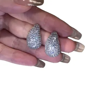 Elegant silver-colored teardrop stud earrings encrusted with sparkling cubic zirconia stones