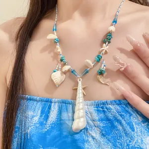 Close-up of bohemian beach style beaded necklace with starfish and white shell pendants