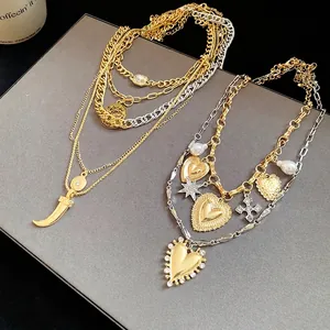Vintage layered gold and silver heart necklace set with rhinestone and cross charms