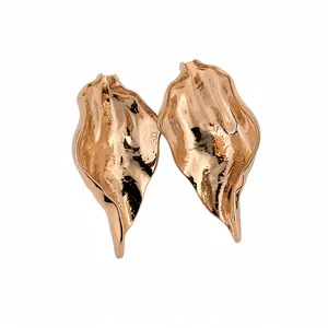 Chic gold-tone pleated leaf stud earrings with a textured organic design.
