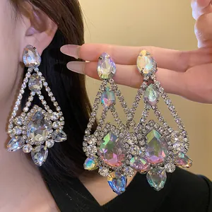 Detailed view of sparkling iridescent waterdrop pendant earrings with elegant silver needles.