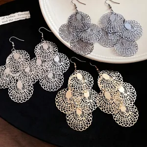 Elegant large hollow metal filigree drop earrings available in gold, silver, and black finishes