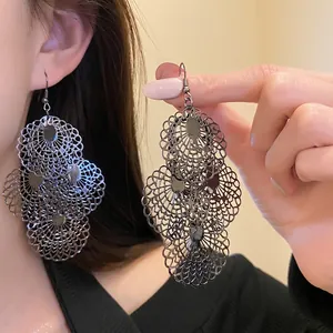 Exaggerated metal hollow lace drop earrings in a vintage dark silver finish for women