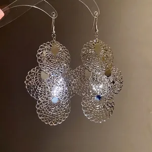 Elegant silver metallic hollowed-out lace circular dangling earrings with vintage design
