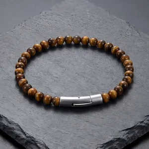 Bracciale retrò di perle occhio di tigre con bottone a pressione in acciaio inox.