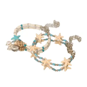 Handmade ocean-themed beaded bracelet set with starfish and shell charms