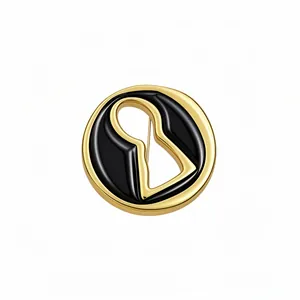 Elegant vintage gold and black keyhole brooch pin in a classic retro court style