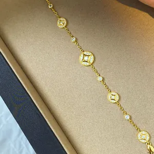 Macro view of 18k gold-plated bracelet with sparkling zircon circular charms