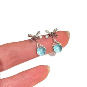 Elegant silver bow-knot drop earrings featuring sea-blue round zircon stones for women