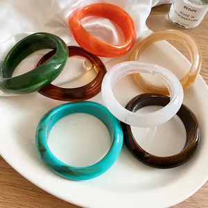 Stylish irregular geometric acrylic bangles featuring elegant marble ink texture designs