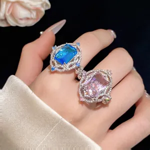 Vintage palace style open ring with blue and pink square zircons in a luxury design.